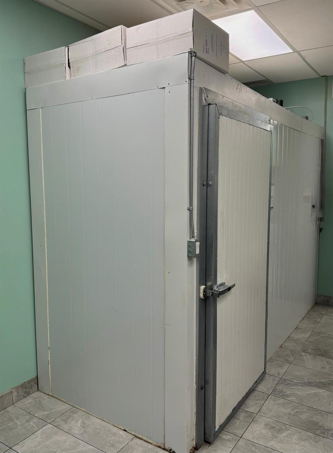The fridge in a building thats for sale in Mission