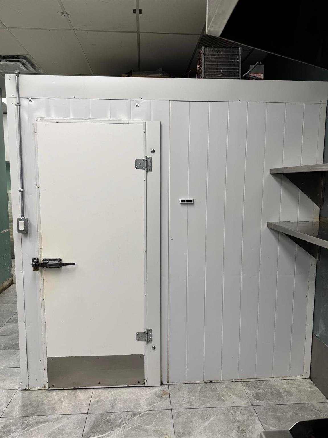 The fridge in a building thats for sale in Mission
